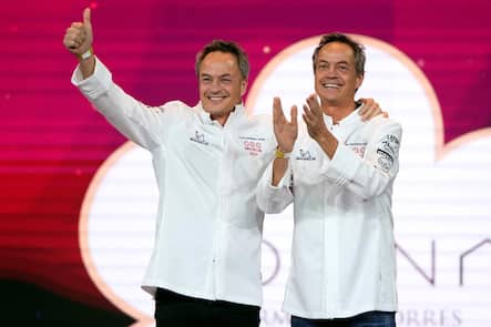 Spanish chefs Javier Torres y Sergio Torres react to retaining their third Michelin star for their restaurant Cocina Hermanos Torres during the presentation of the 2024 Michelin gastronomy guide for Spain and Portugal, in Barcelona on November 28, 2023. (Photo by Pau BARRENA / AFP)