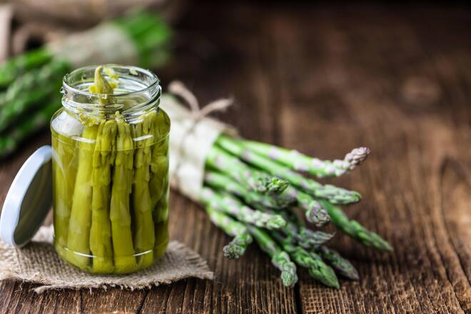 FTAGA8 Preserved green Asparagus (selective focus) on wooden background Byline AlamyÂ