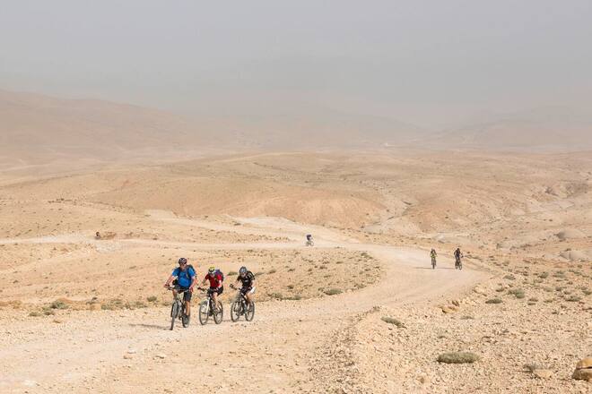 A group of mountainbikers on their bike expedition in the Jordan highland desert.