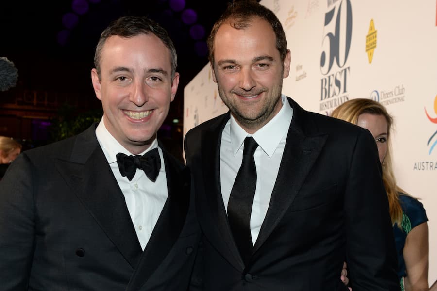 Will Gudara and Daniel Humm pose on the red carpet during the World's 50 Best Restaurants awards in Melbourne on April 5, 2017. The awards this year were held outside of London or New York for the first time with Australia fast earning a reputation as a serious food destination, attracting some of the world's top chefs to open restaurants Down Under. / AFP PHOTO / Mal Fairclough