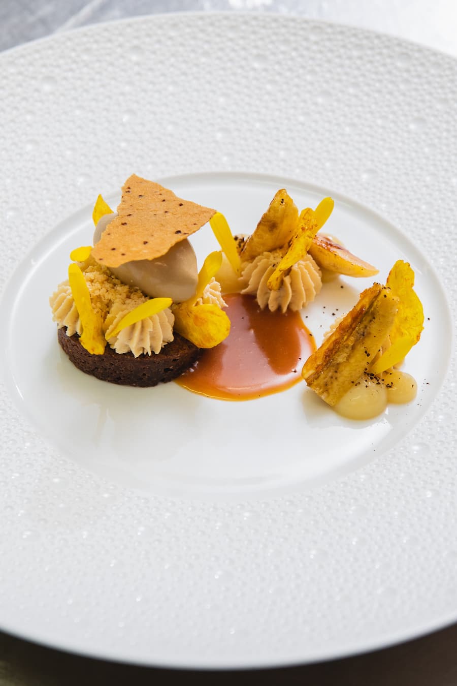 Stefan Lünse, Lenk, Lenkerhof, Restaurant Spettacolo, Nespresso Lounge, Dessert, Schokoladenbrownie, Karamellsauce, Kaffeeeis, Bananencreme, Chantilly, Kaffetuille
