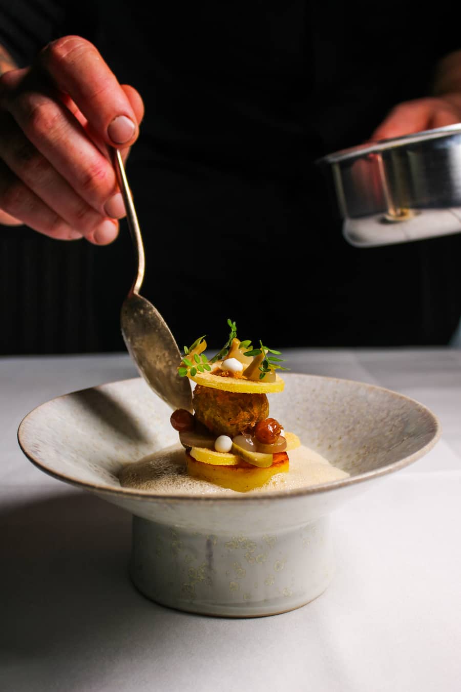 Gericht Veganer Zwischengang: Kartoffel, Sauerkraut, Oliven, Rosinen