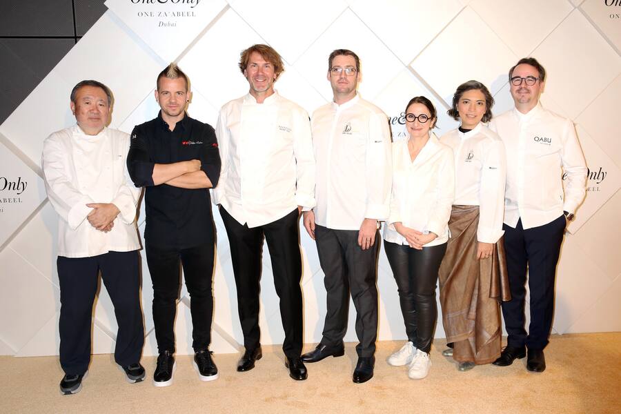 DUBAI, UNITED ARAB EMIRATES - FEBRUARY 10: (L to R) Chefs Tetsuya Wakuda, Dabiz Munoz, Mehmet Gürs, Dylan Jones, Anne-Sophie Pic, Bo Songvisava, Paco Morales pose on the red carpet at the One&Only One Za'abeel Grand Opening at Aelia on February 10, 2024 in Dubai, United Arab Emirates. (Photo by Darren Gerrish/Getty Images for One&Only)