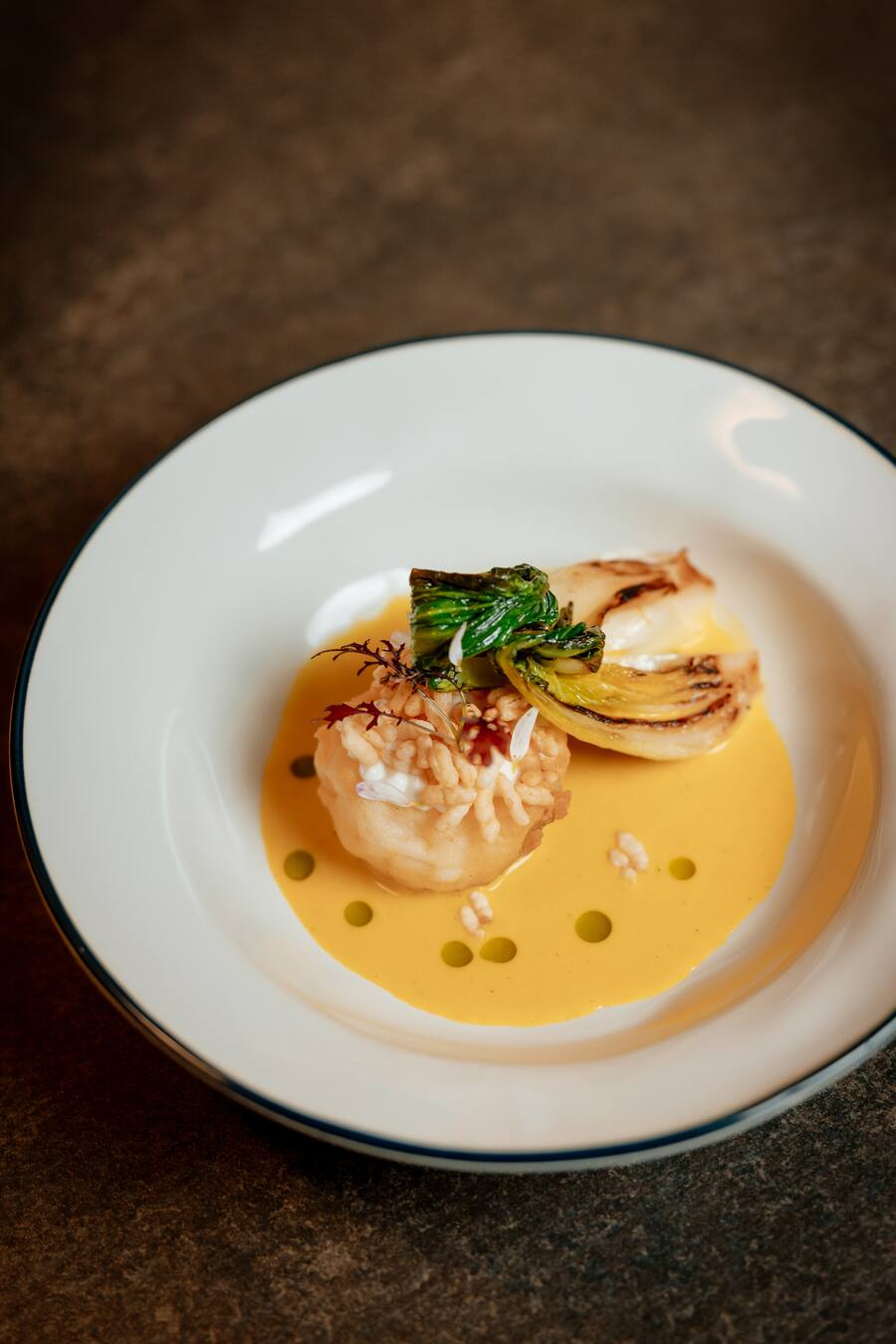 20.11.2024, Zuerich, Sapori Ticino Gala im Widder Hotel | Gericht: Seeteufel, Pak Choi, Curry von Luca Bellanca - Ristorante META in Lugano (photo by Remy Steiner for Gault Millau)