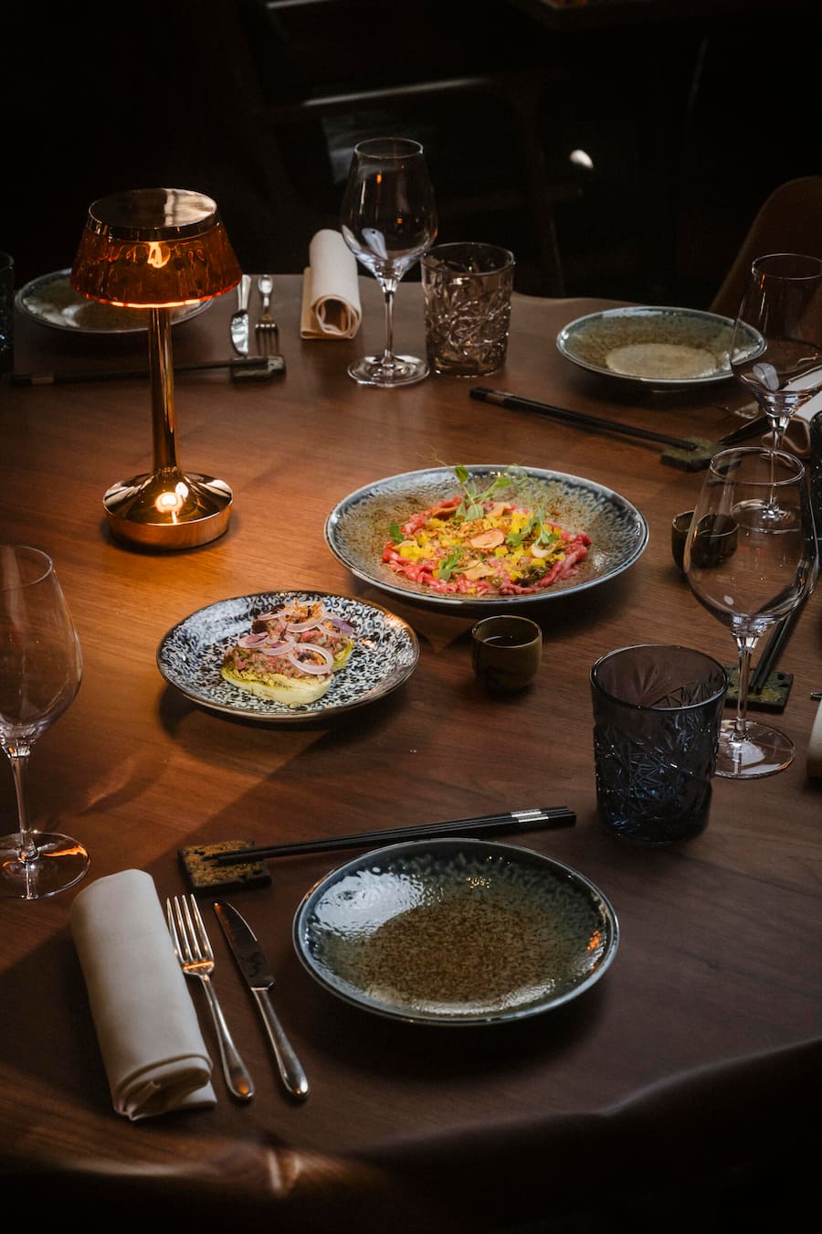 Swiss Wagyu Carpaccio, ponzu-wasabi sauce, takuan, black garlic emulsion, soy cured egg yolk and a Peruvian coffee infused Beef consommé Schweizerhof La Muña, Friday 13 December 2024 in Zermatt. (© Gabriel Monnet)