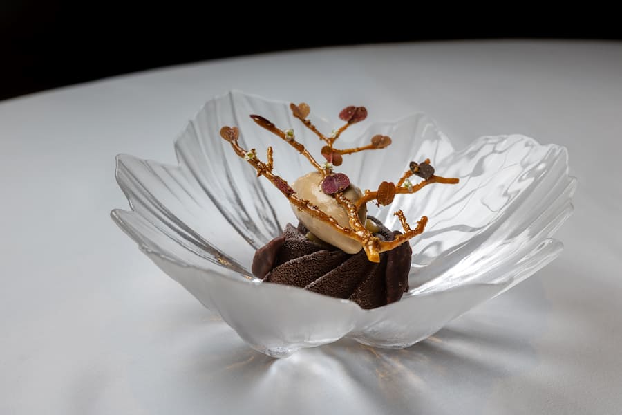 Hazelnut praline parfait, black apple ice cream, artichoke twig