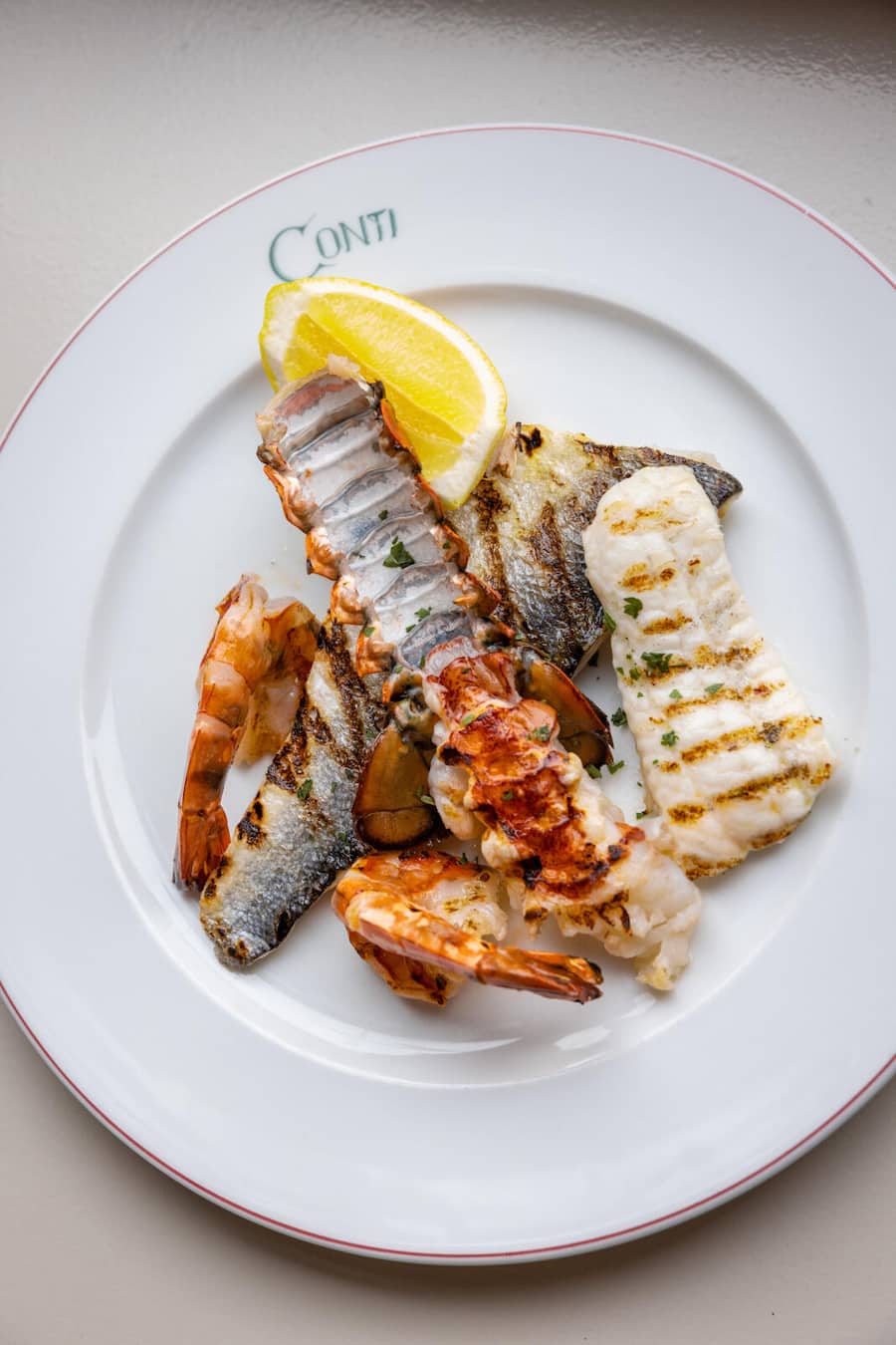15.12.2026, Zürich, Restaurant Conti, Gericht; grigliata di pesce (photo by Remy Steiner for Gault Millau)