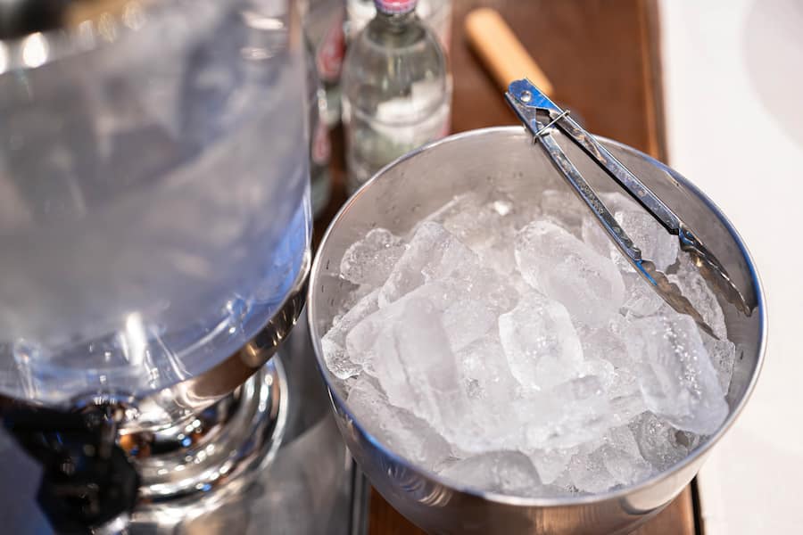 Ice bucket in evening restaurant background