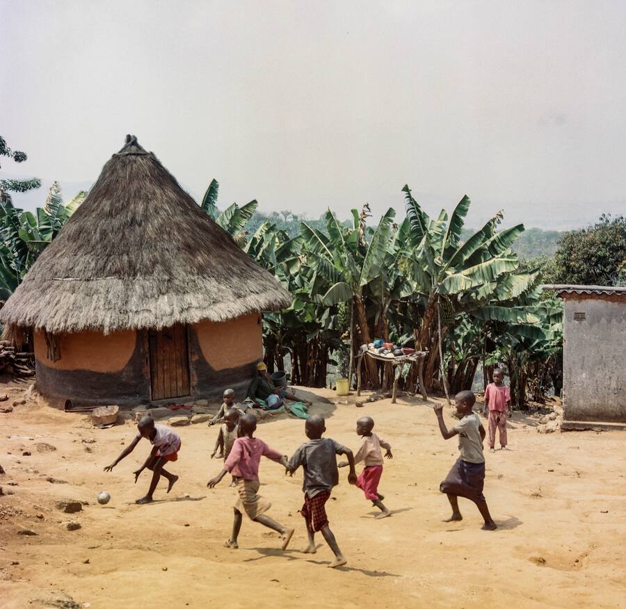 Local kids play football in the courtyard, Honde Valley, Zimbabwe